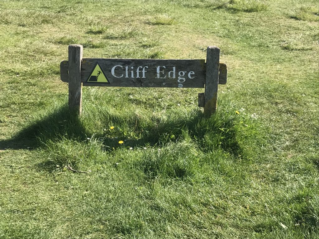 A warning of Cliff Edge on Beach Head in Eastbourne