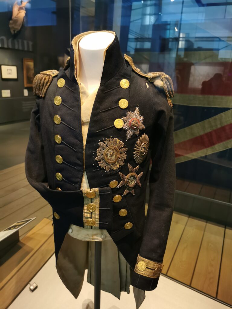 Nelsons jacket, the bullet hole can be seen on the left shoulder