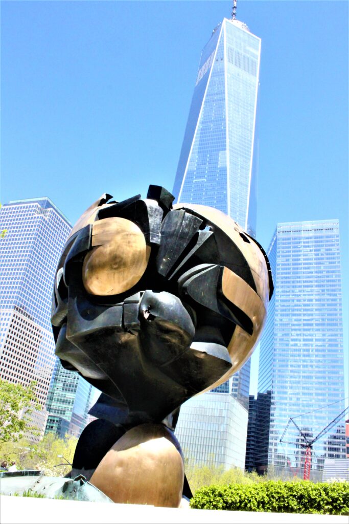 The Golden Sphere in Liberty Park with One World Trade Centre in the backdrop